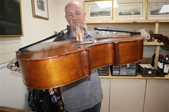 A cased cello with bow